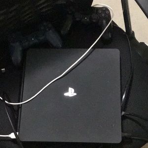 PS4 console with 2 controllers